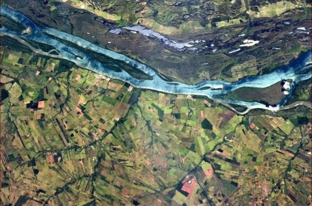 "A blue river in Brazilian farmland provides a striking contrast of colour and landscape." - Chris Hadfield