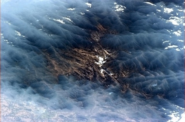 "Venezuelan valley framed by misty clouds - mysterious, beautiful and surreal." - Chris Hadfield